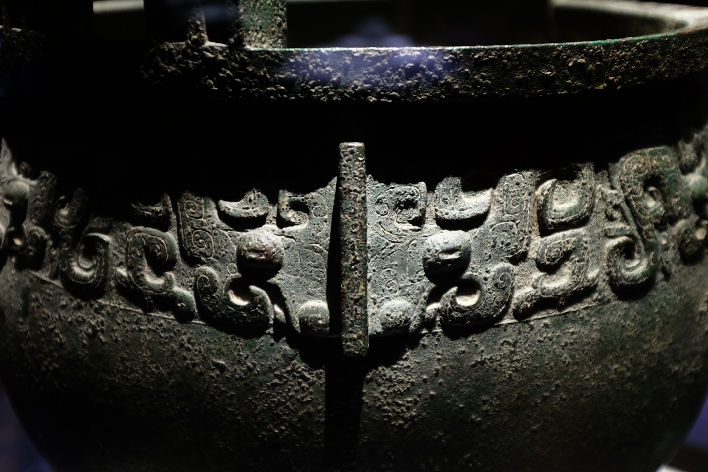 Ancient bronze vessel with intricate carvings